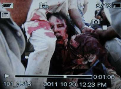 muammar-ghaddafi-wounded-AFP